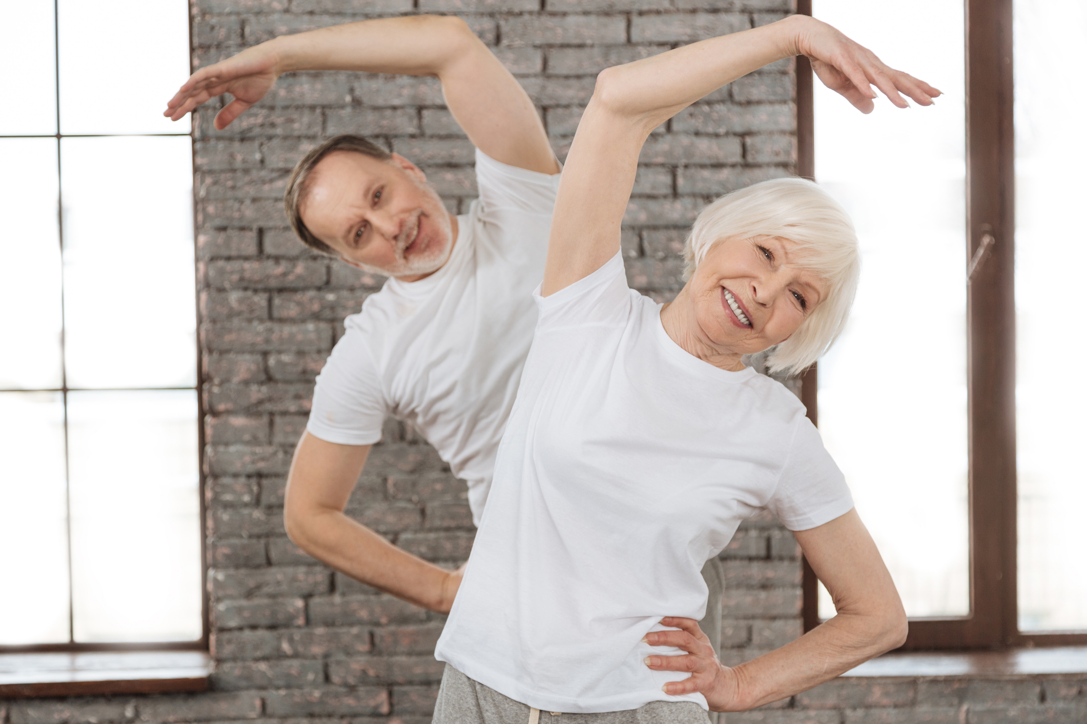 Attractive old woman doing morning exercises